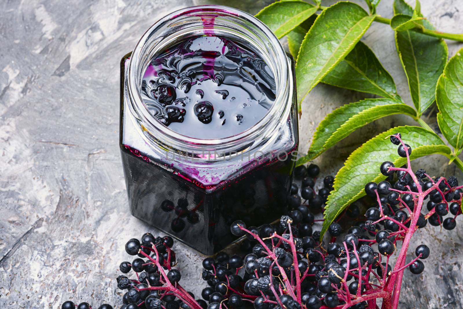 Elderberry jam and fresh berries.Homemade pozzy.Marmalade or confiture