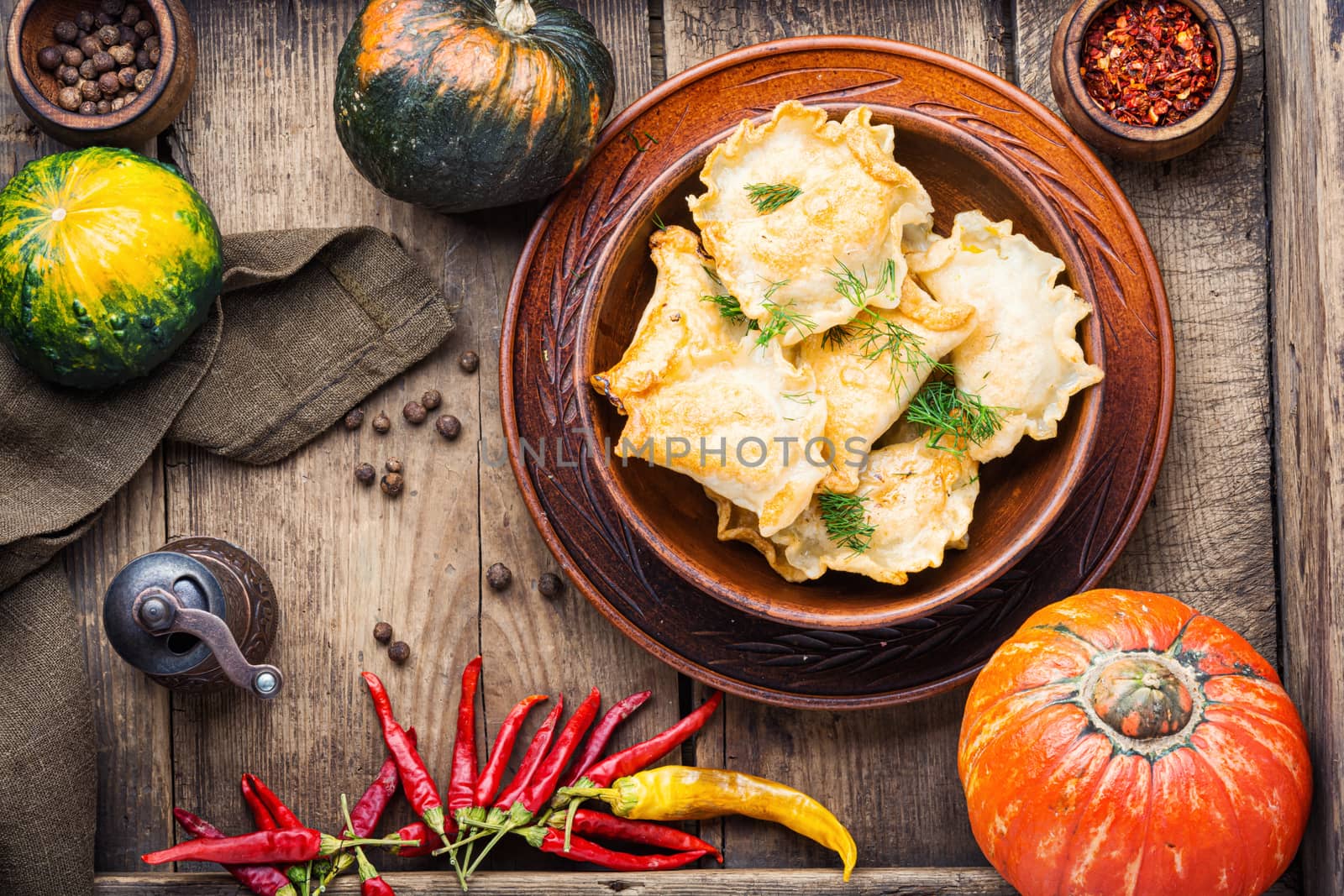 Traditional autumnal pumpkin dumplings.Fried pumpkin vareniki.Autumn food