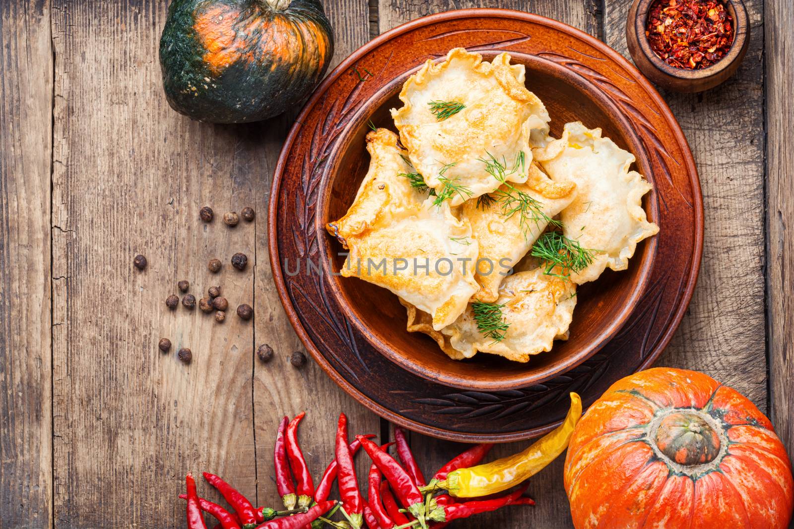 Traditional autumnal pumpkin dumplings.Fried pumpkin vareniki.Autumn food