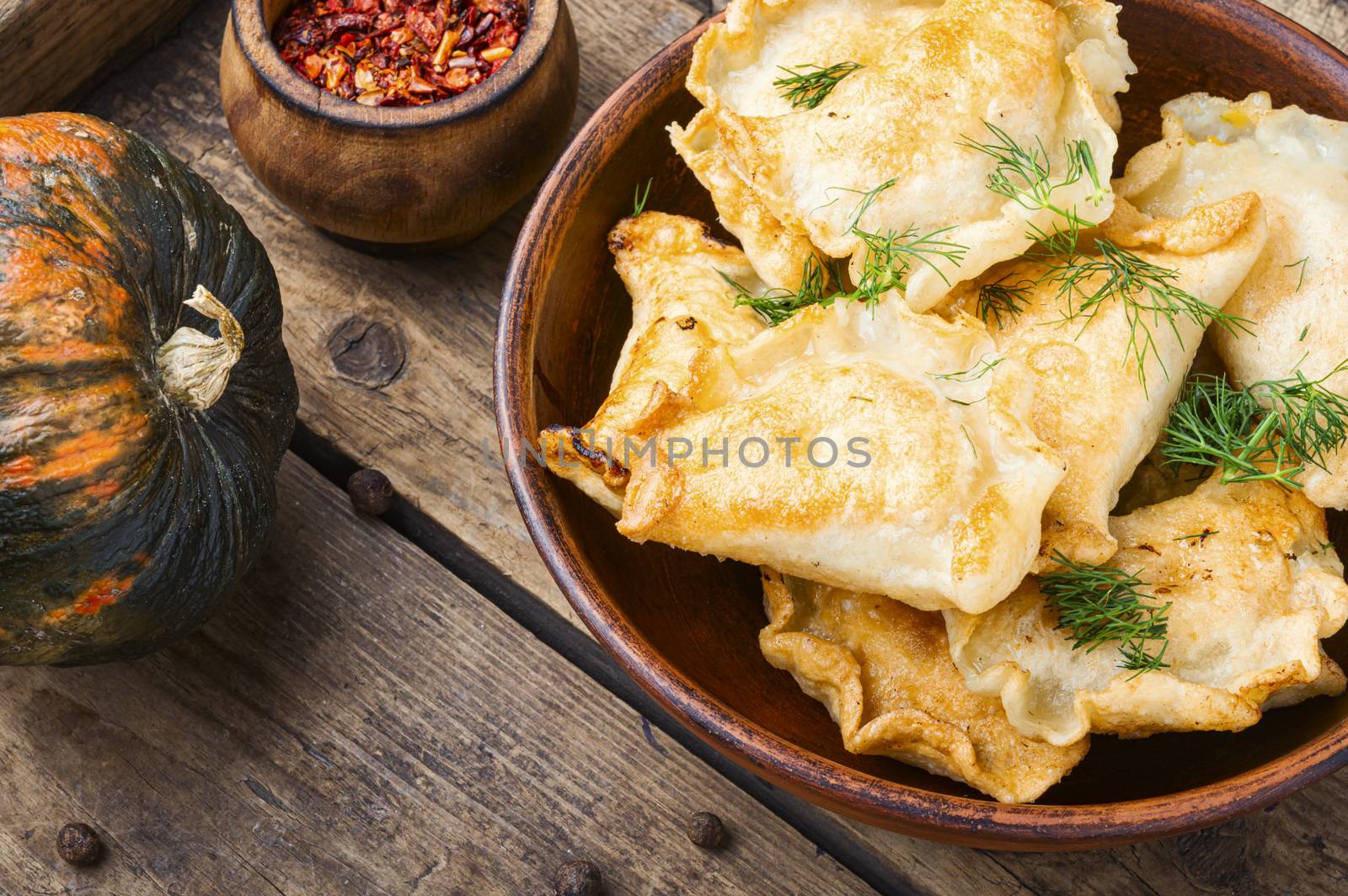 Traditional pumpkin dumplings or vareniki.Fried pumpkin vareniki.Autumn food