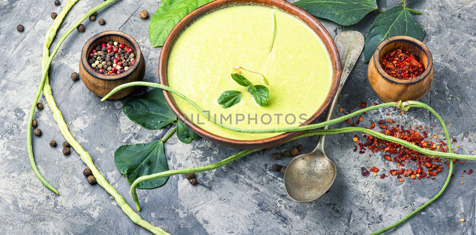Fresh asparagus soup in bowl by LMykola