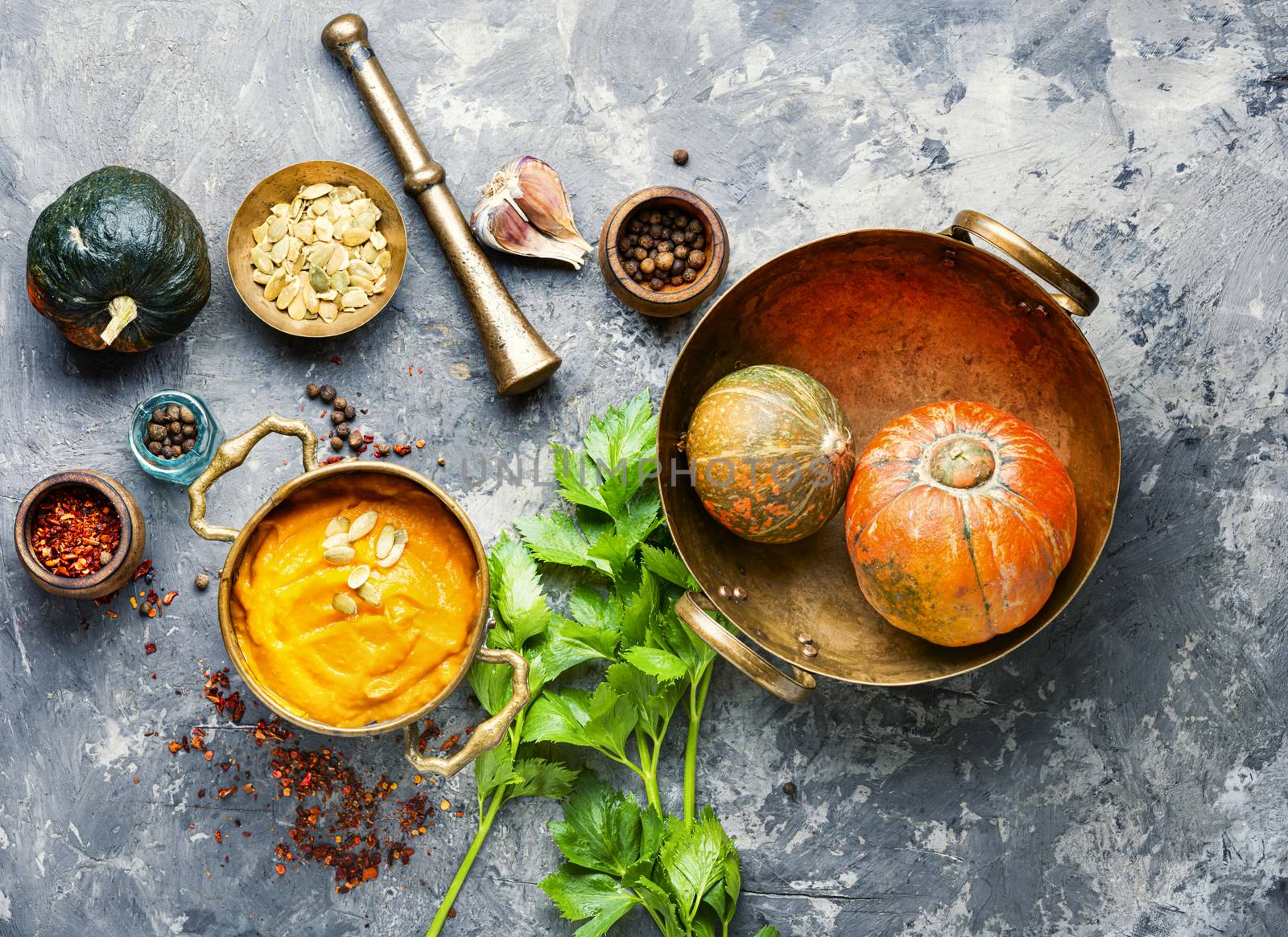 Vegetarian autumn pumpkin cream soup.Pumpkin soup and pumpkins