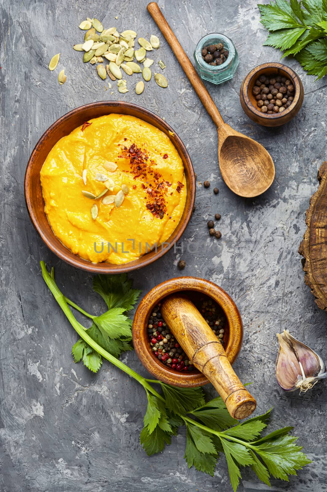 Vegetarian autumn pumpkin cream soup.Pumpkin soup and pumpkins