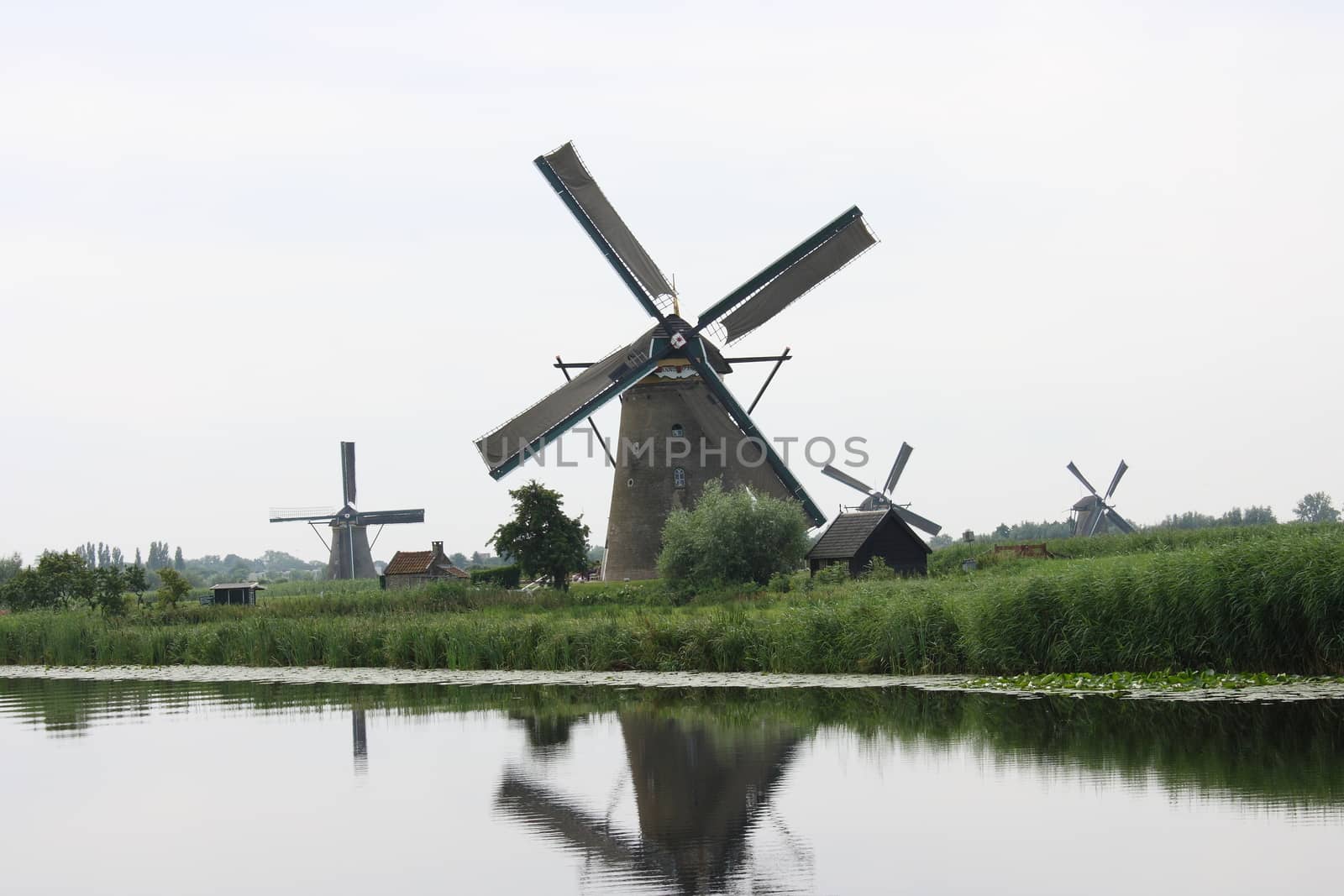 A beautiful, old, historic windmill, with four wings 