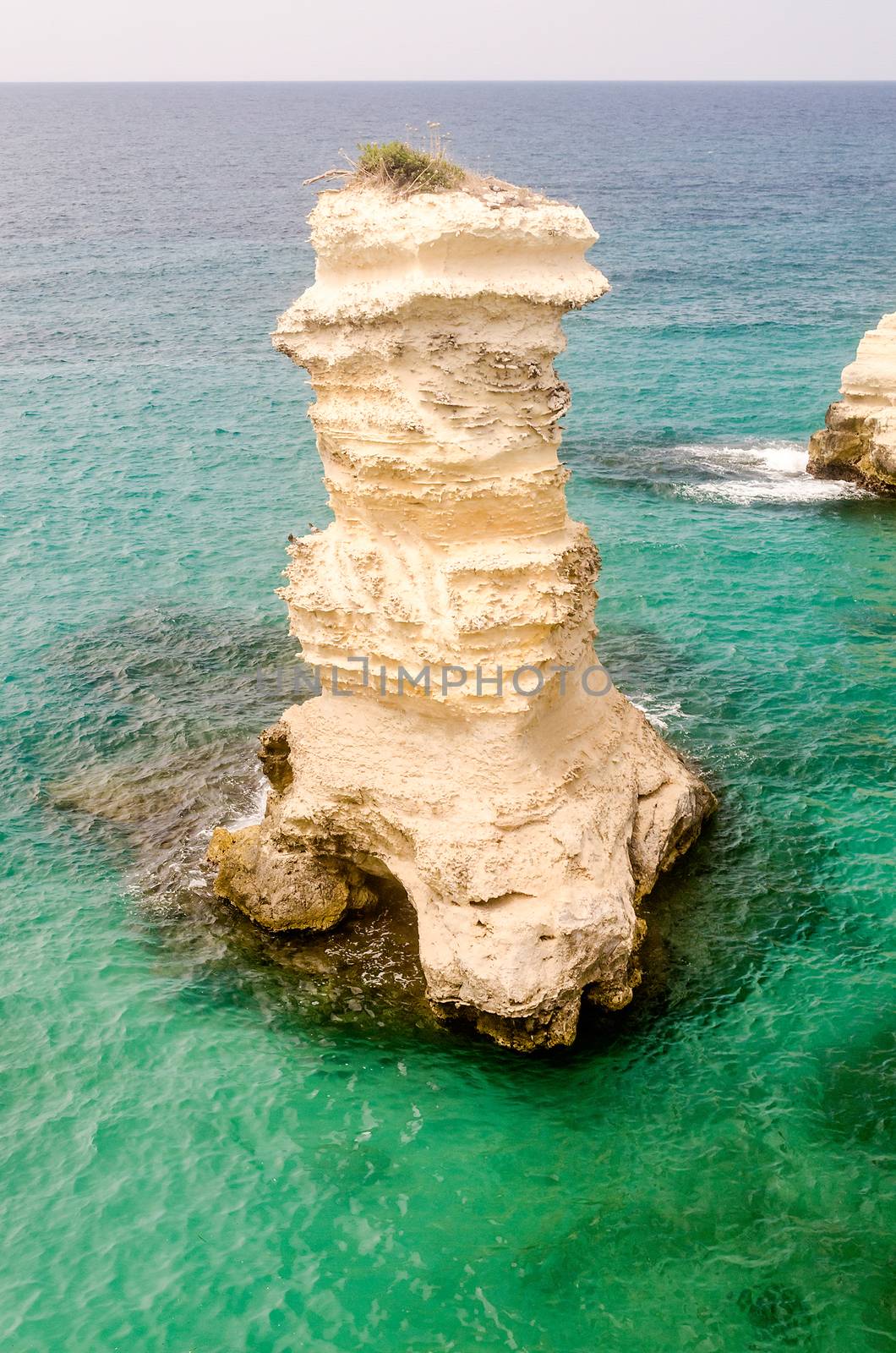 Scenic view of the rocky cliffs in Torre Sant Andrea town, Salento, Apulia, Italy