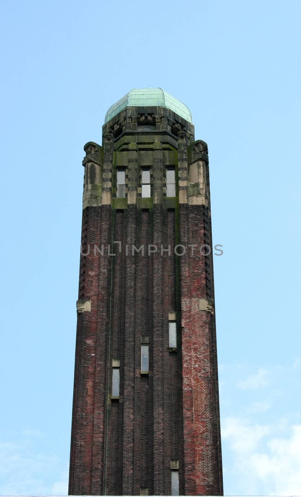 a tower built of red brick stones 