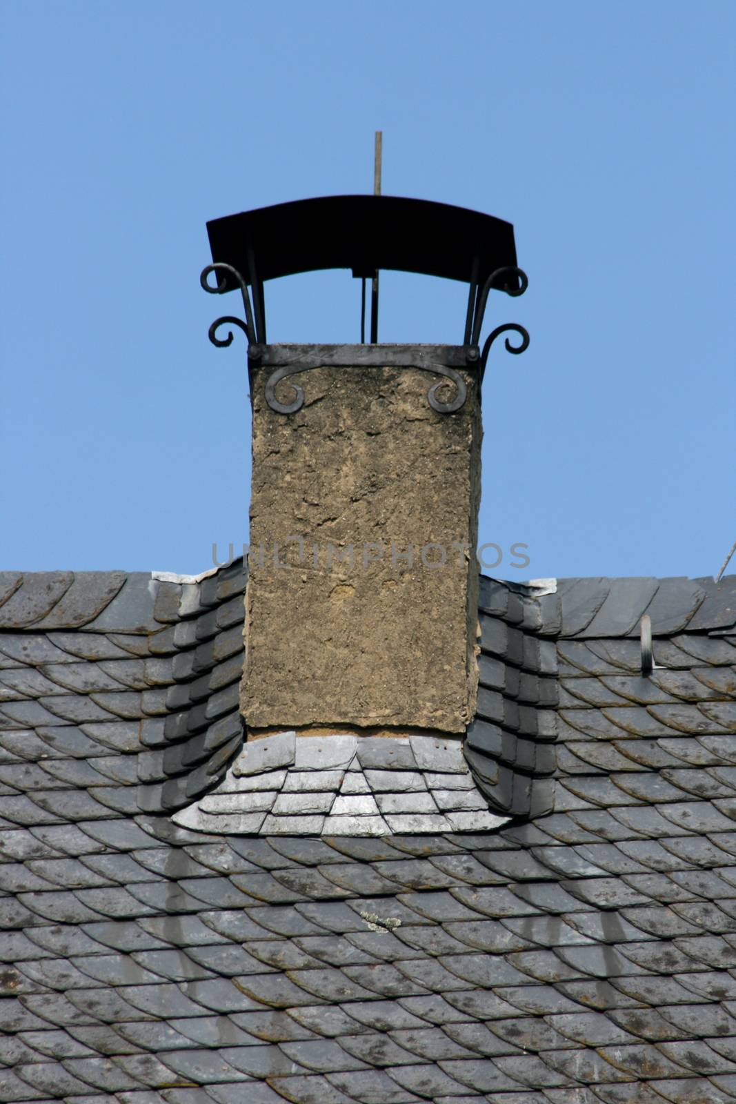 Chimney hood on slate roof
