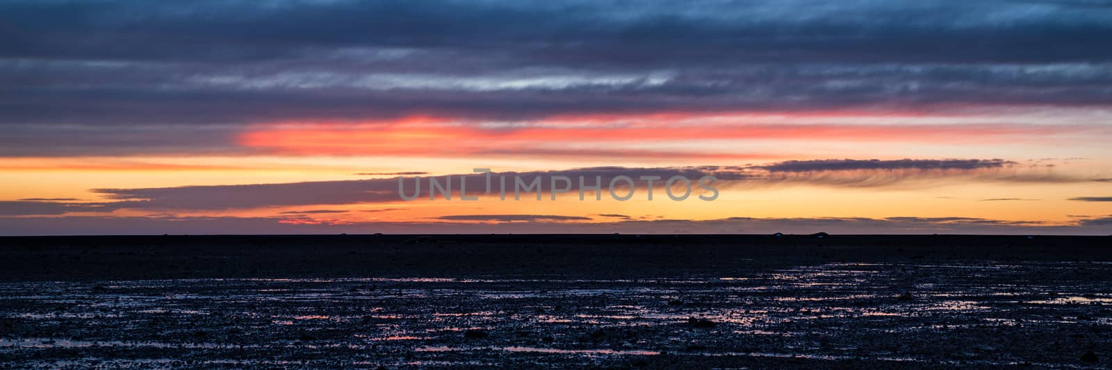 Sunset in the black beach of Solheimasandur, Iceland