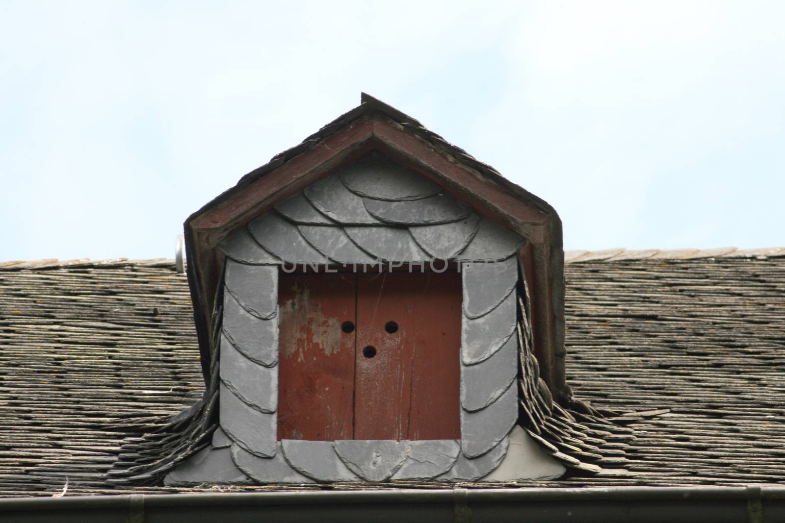 Dormer with red shutters
