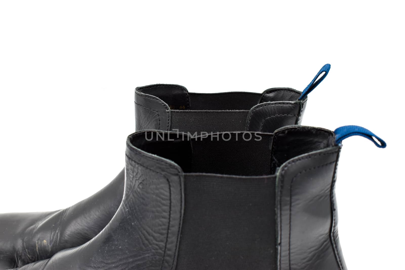 close up of a pair of black mens leather chelsea boots isolated on white background by benentaylor