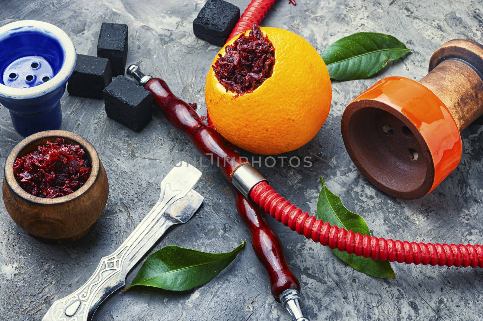 Details of tobacco hookah and tobacco with orange aroma.Fruit shisha