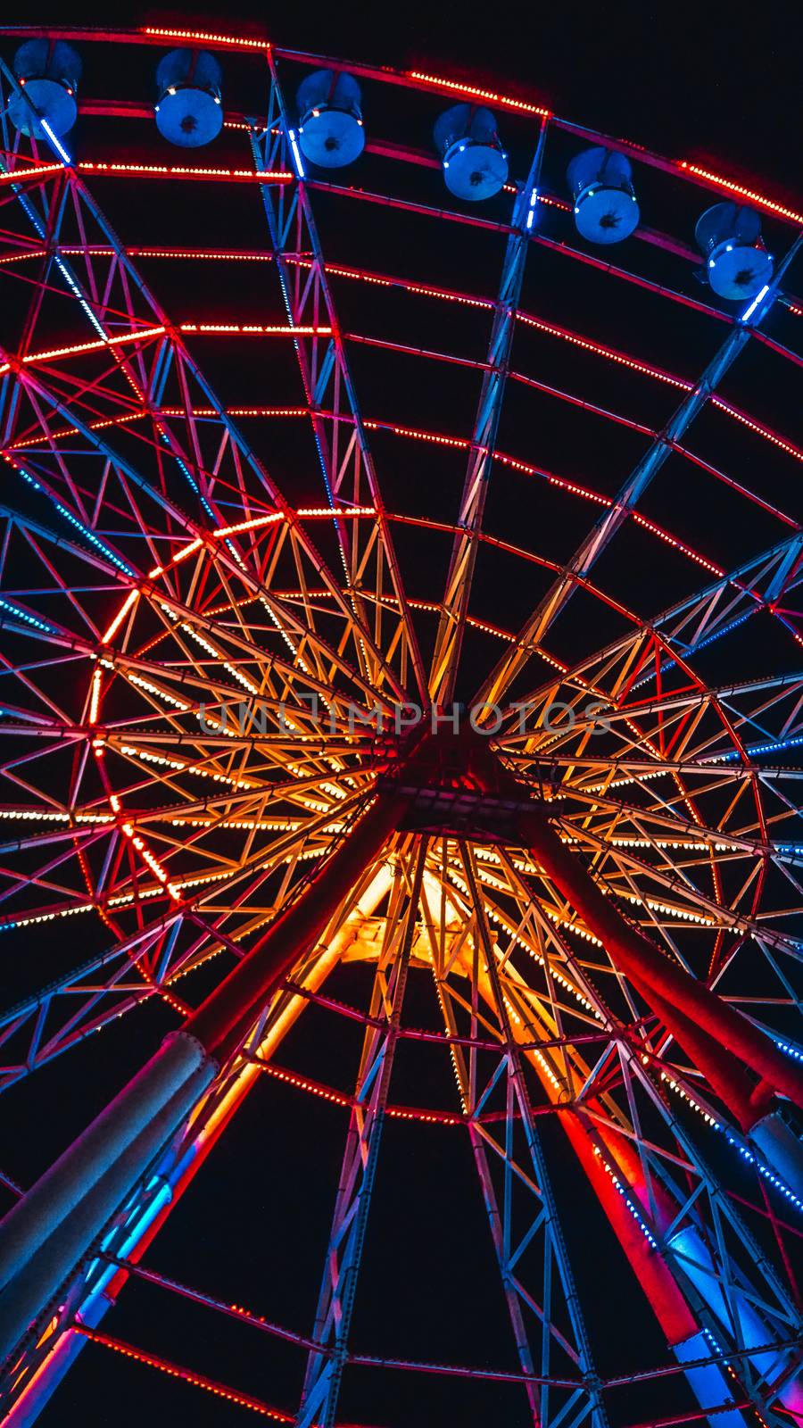 Modern ferris wheel in the night. Free time activities.