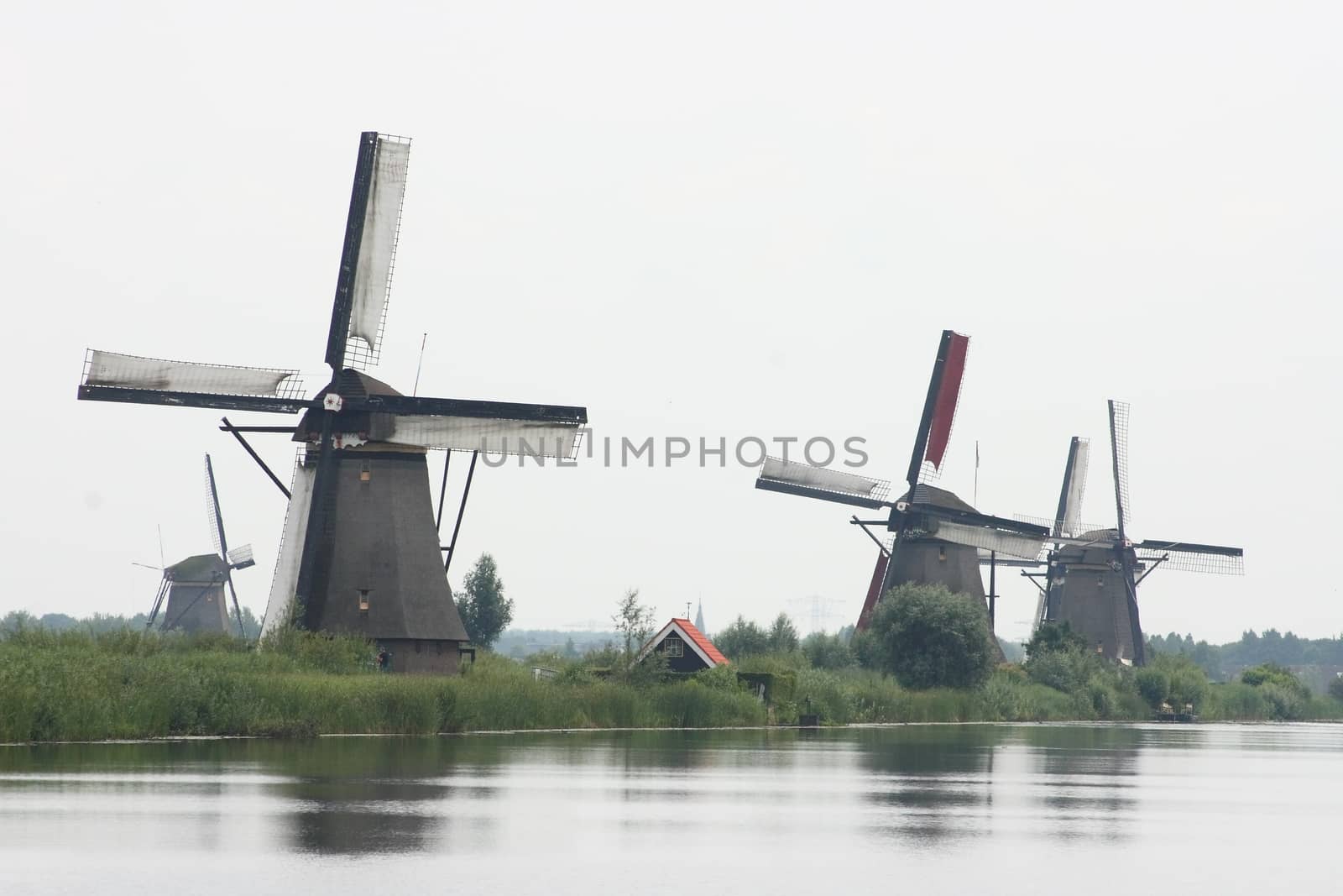 A beautiful, old, historic windmill, with four wings 