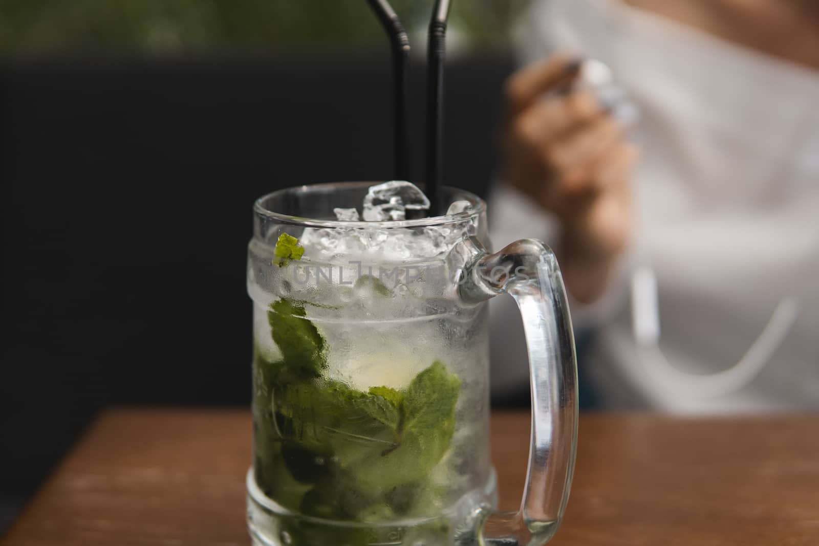 Mojito cocktail with ice cubes in a glass