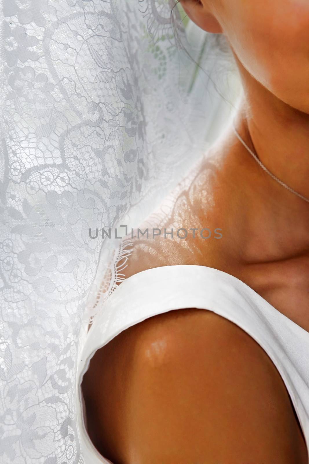 Wedding veil and hand of the bride