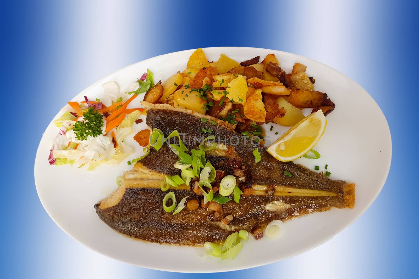 Fish dish-fried fish Plaice fillet and vegetables with fried potatoes