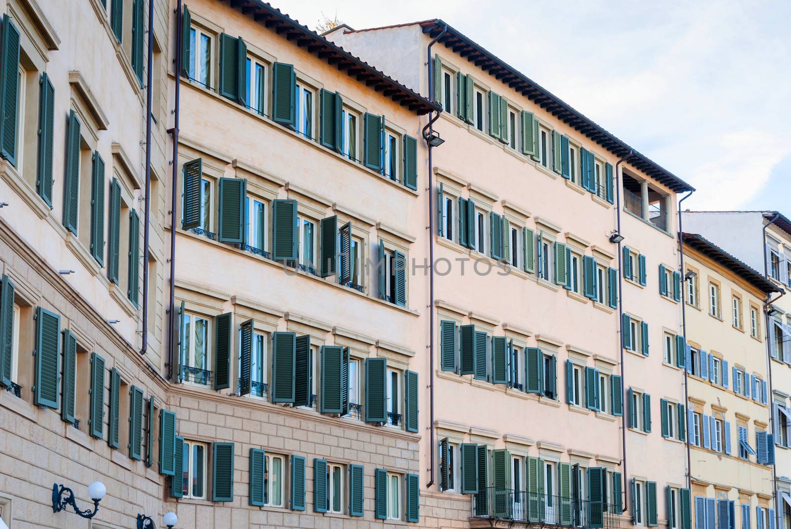 Street with old traditional Italian houses with wooden windows in Florence.