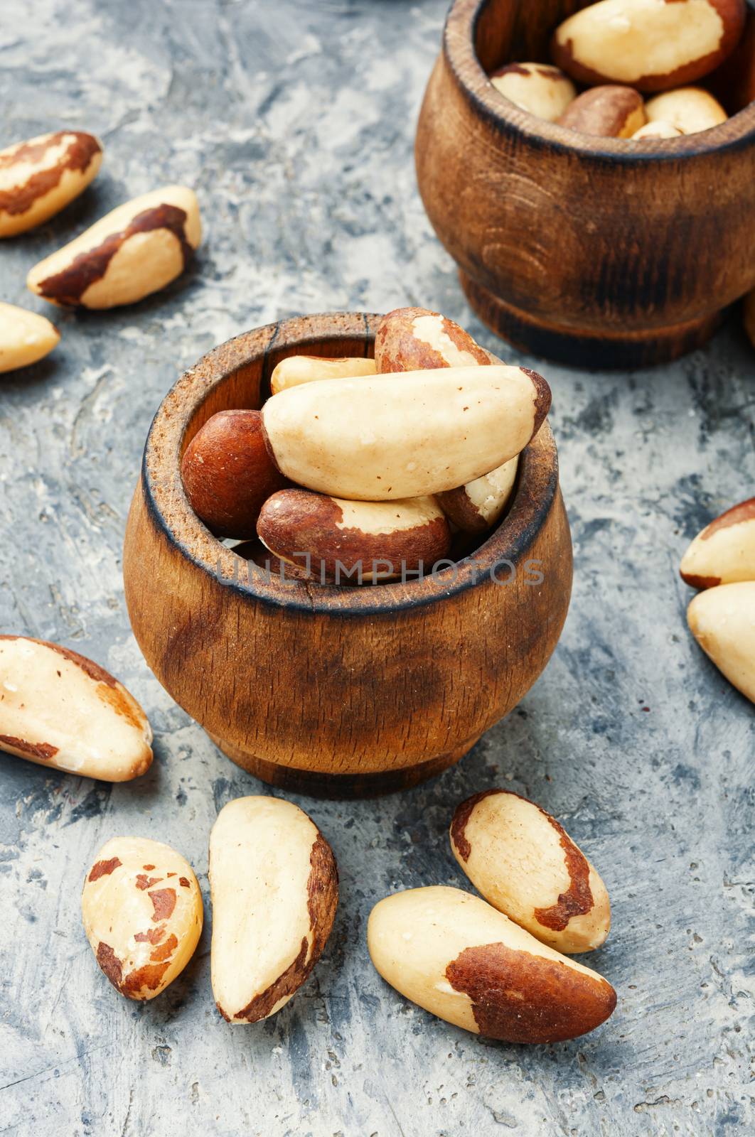 Wooden retro mortar filled with Brazil nut