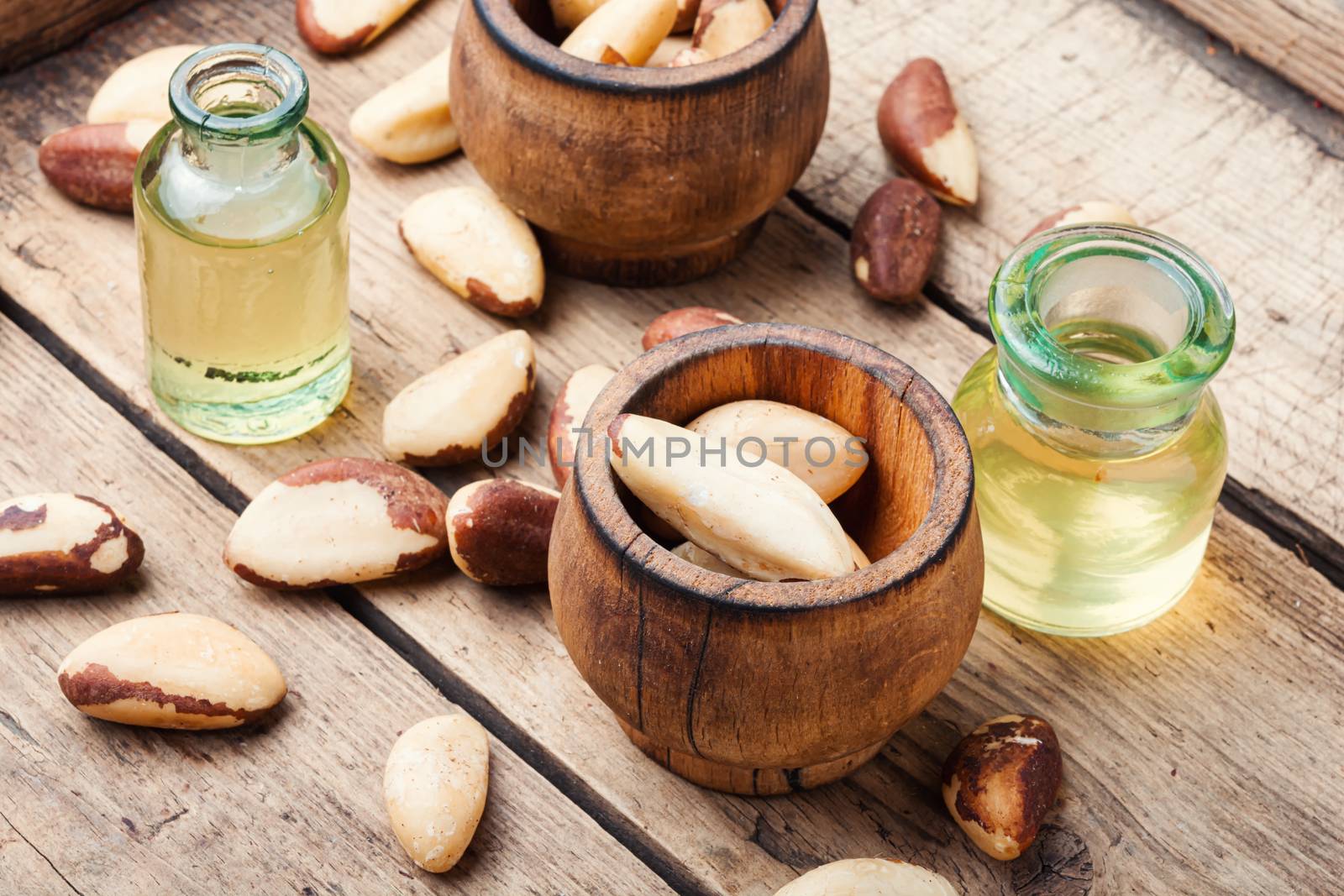 Gourmet peeled Brazil nut and jars of oil.