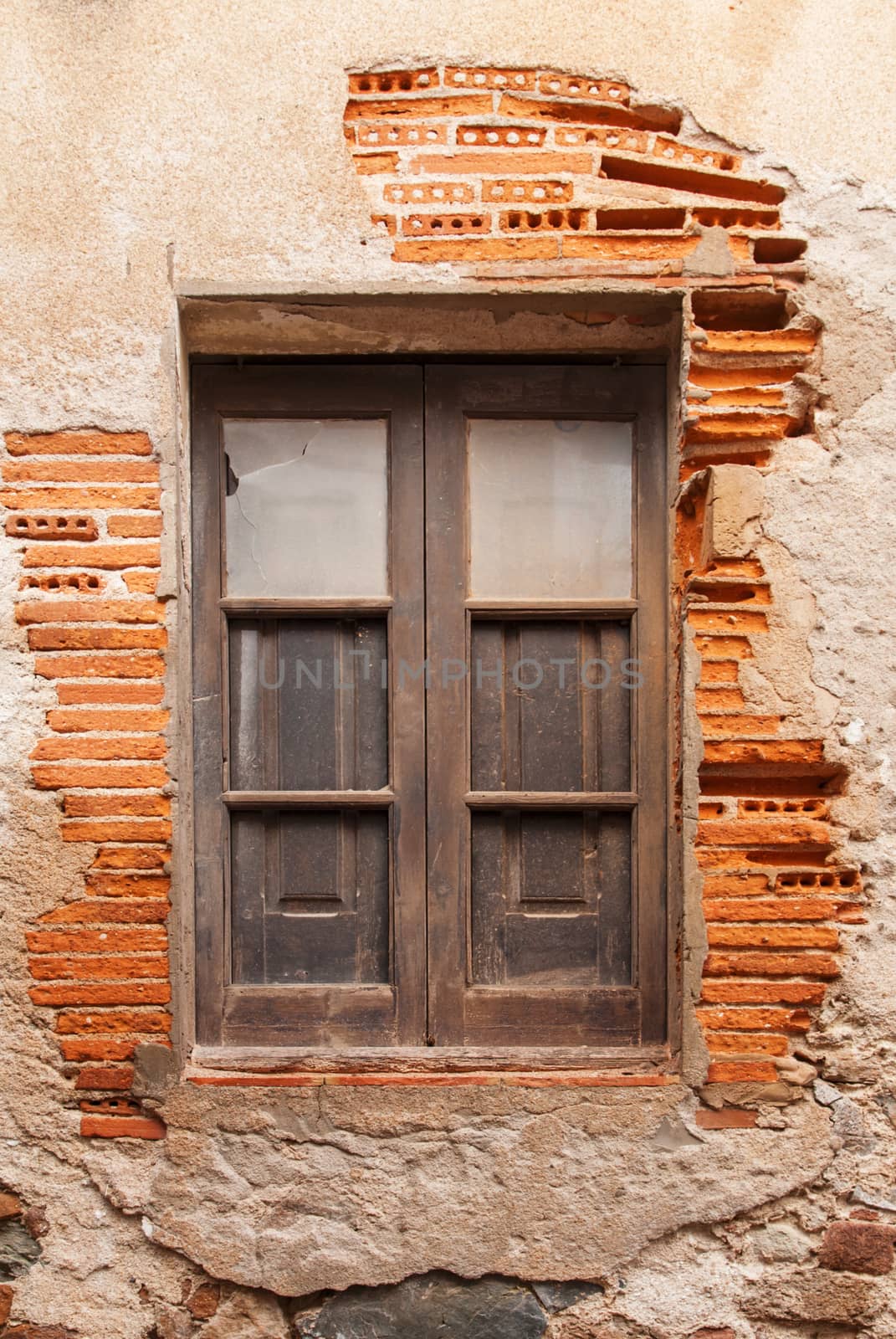 Wooden window in the wall of the ancient building in medieval Old Town - Vila Vella Spain, Tossa de Mar.