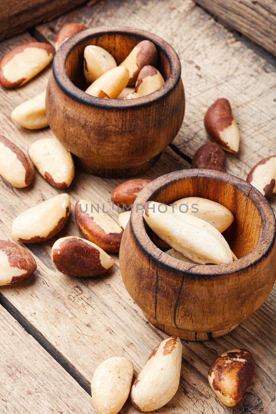 Wooden retro mortar filled with Brazil nut