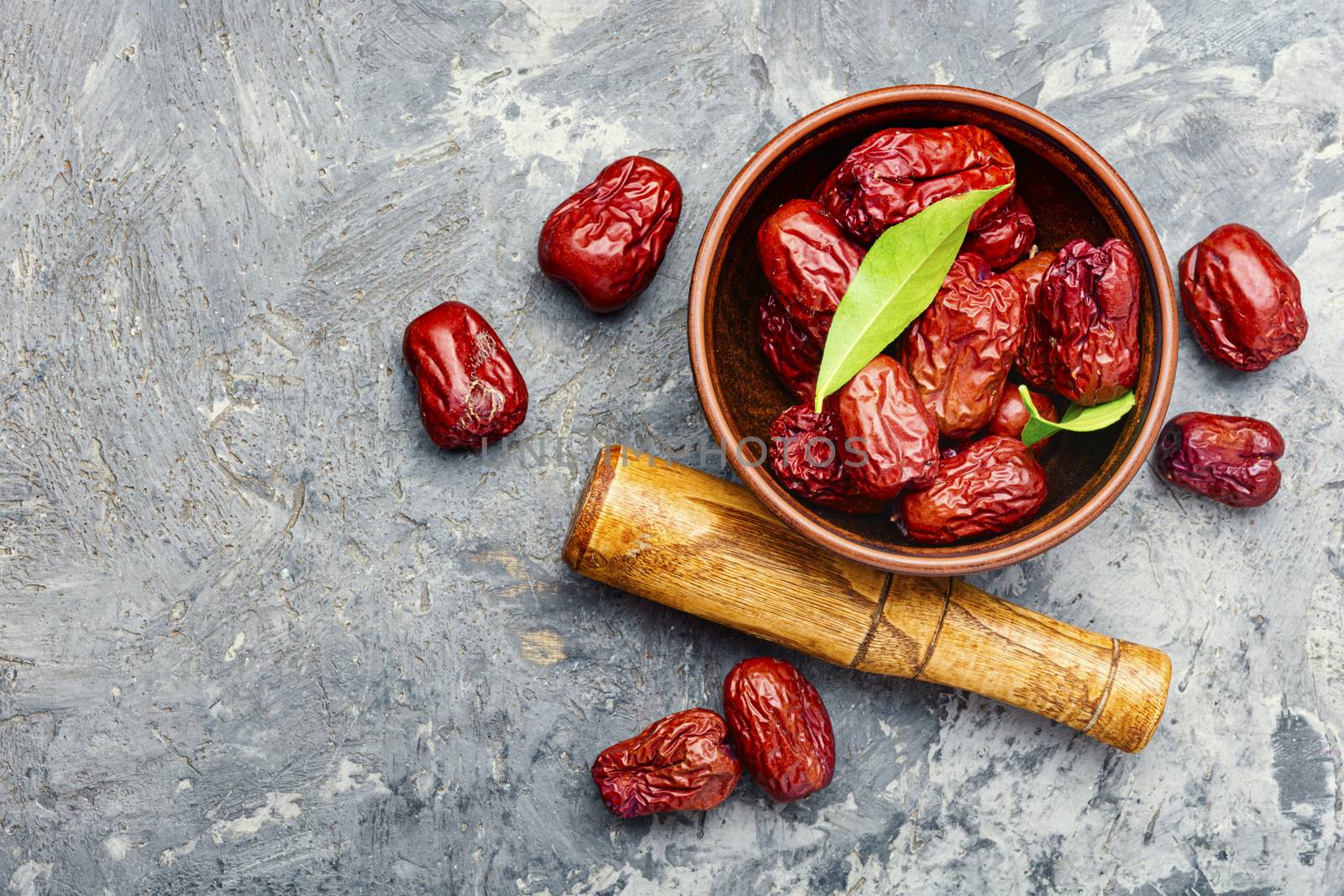 Bowl of dried unabi fruit or jujube.Space for text