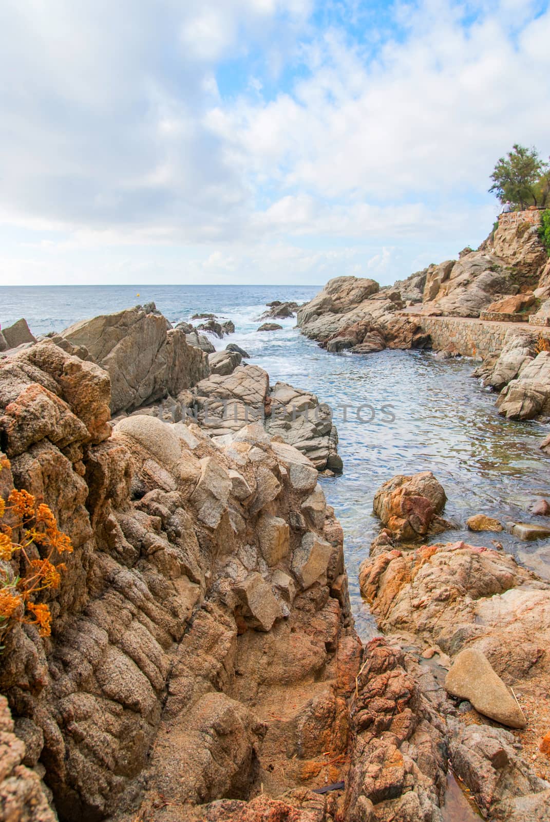 Rocks on the coast of Lloret de Mar in a beautiful summer day, Costa Brava, Catalonia, Spain by Zhukow