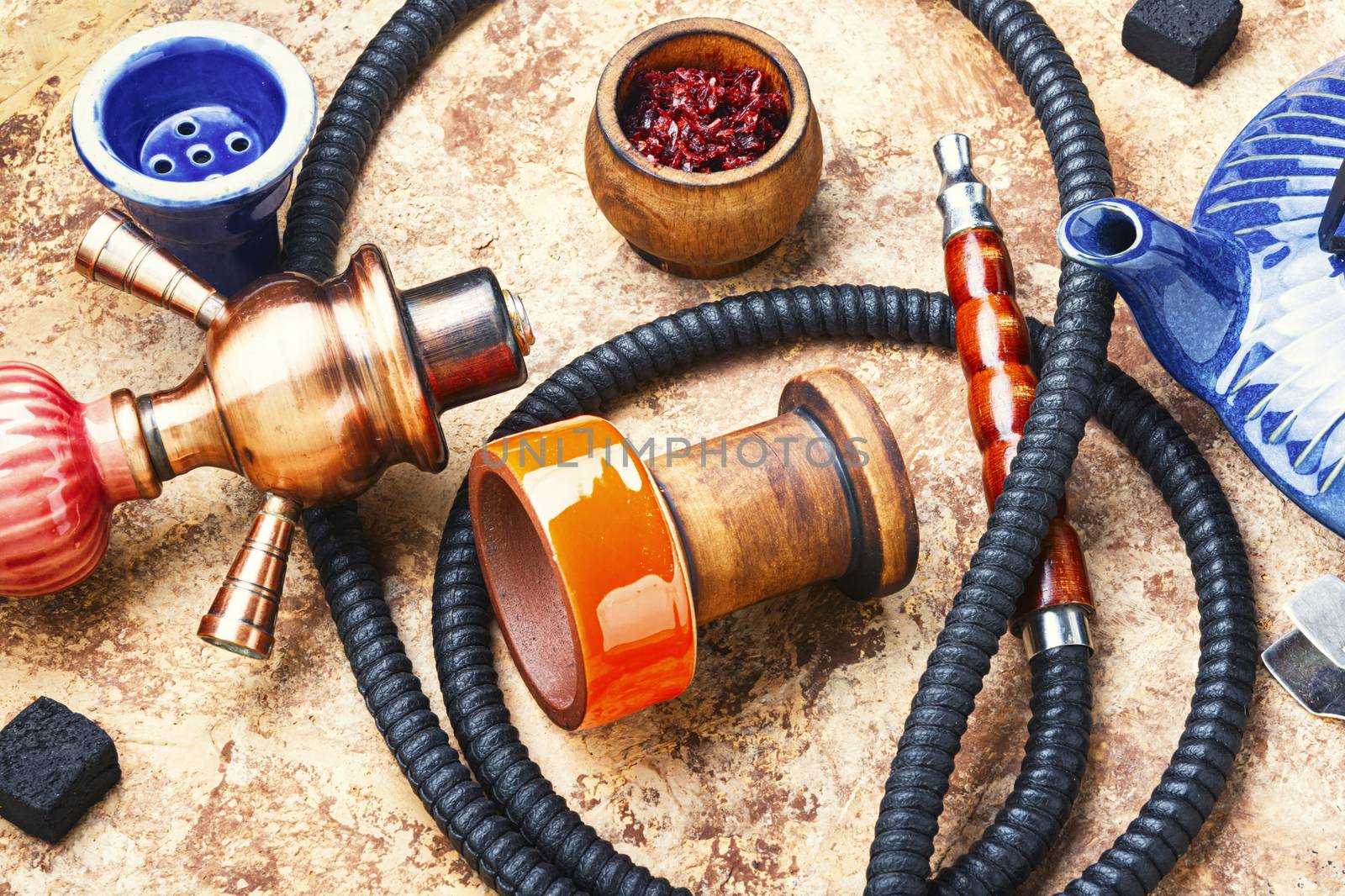 Details of tobacco hookah and teapot with tea.Eastern smoking shisha