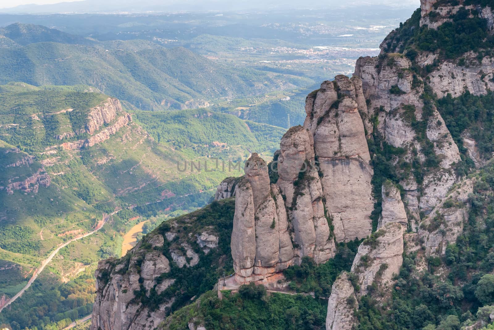 Breathtaking view to Montserrat mountain range on a sunny summer day, Catalonia, Spain by Zhukow