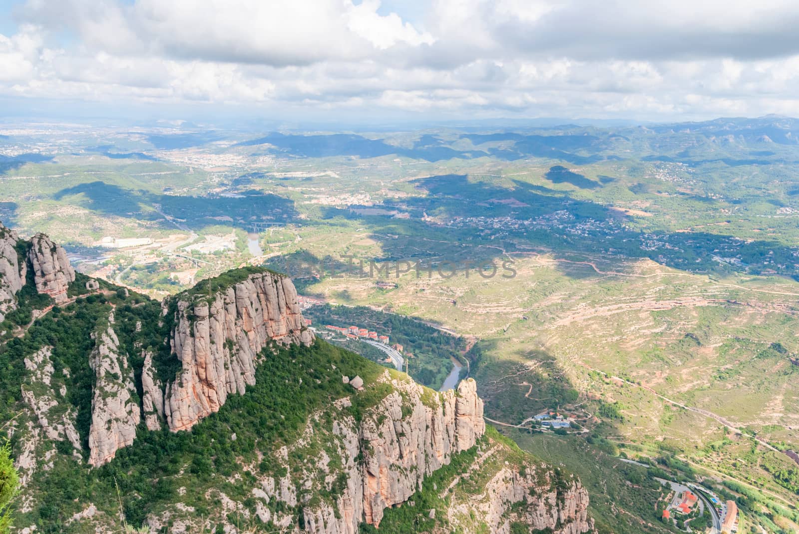 Breathtaking view to Montserrat mountain range on a sunny summer day, Catalonia, Spain by Zhukow