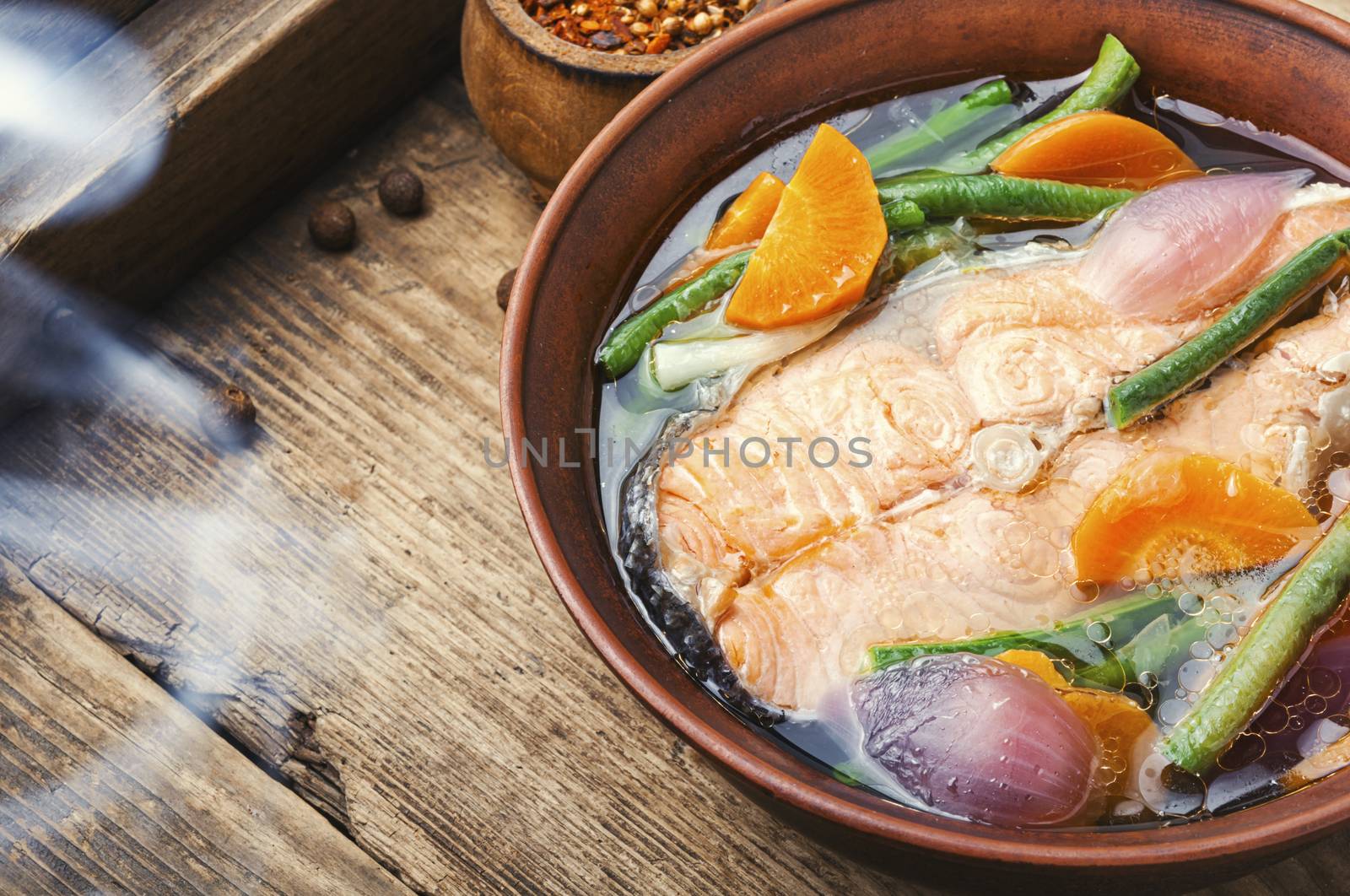 Appetizing dietary boiled salmon or trout.Fish broth