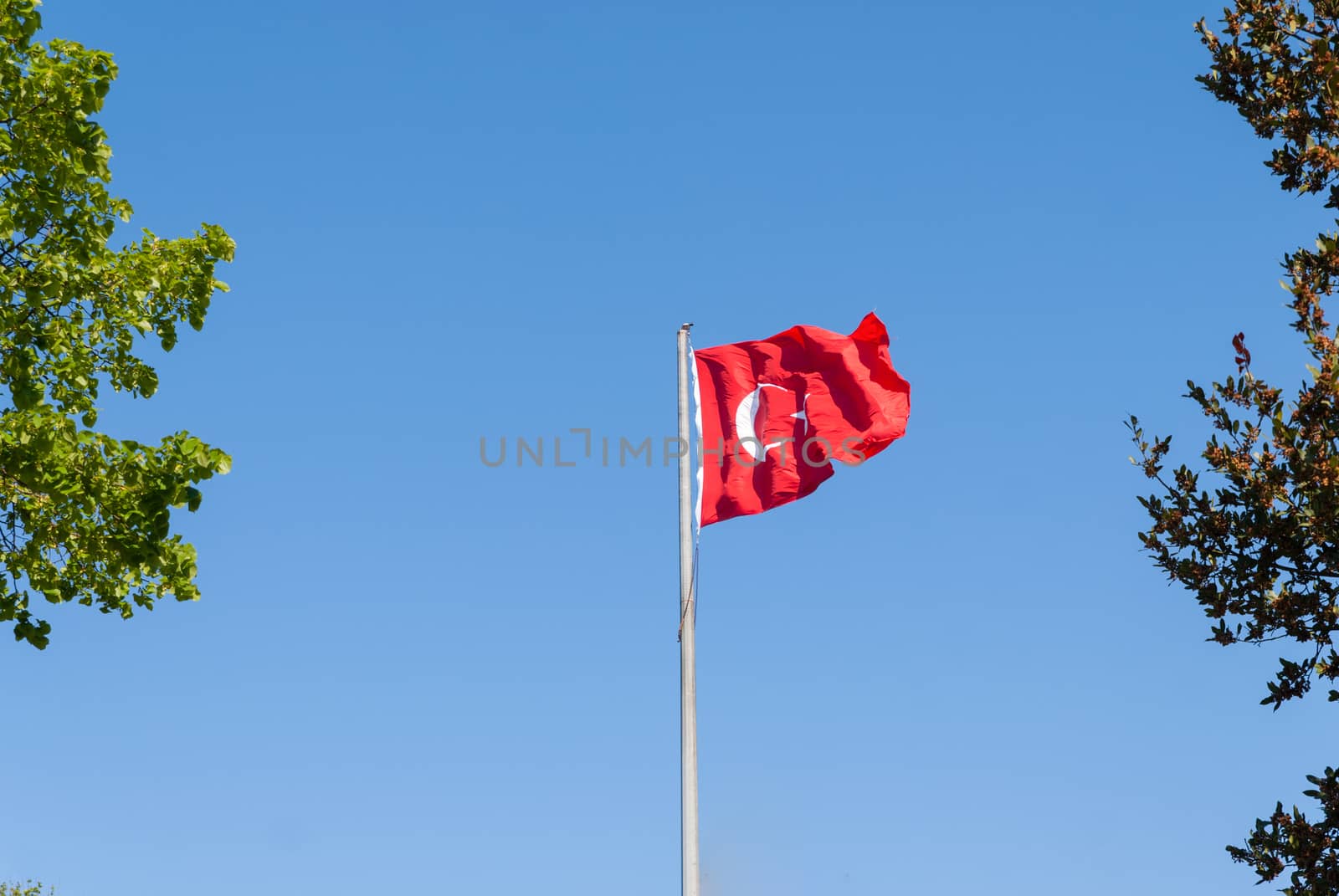 Turkish flag waving in blue sky, Istanbul, TURKEY