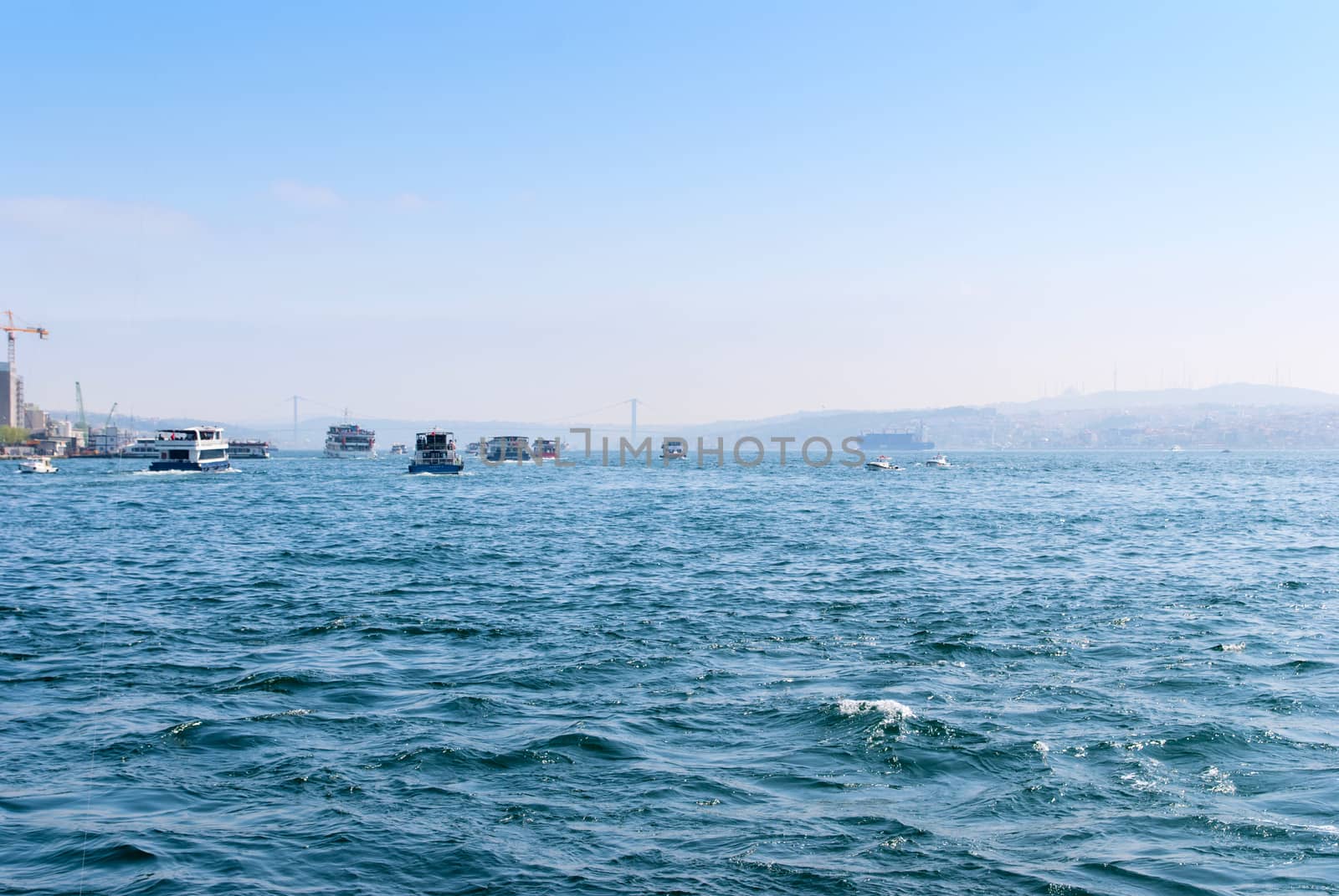 Passenger ferry ship carries people across the Bosphorus Strait along Istanbul, Turkey