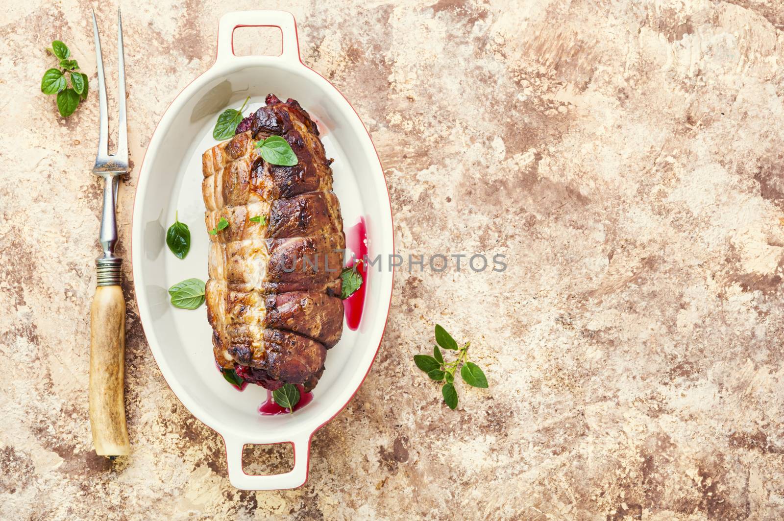 Roasted pork with cherry filling.Baked pork in a baking dish