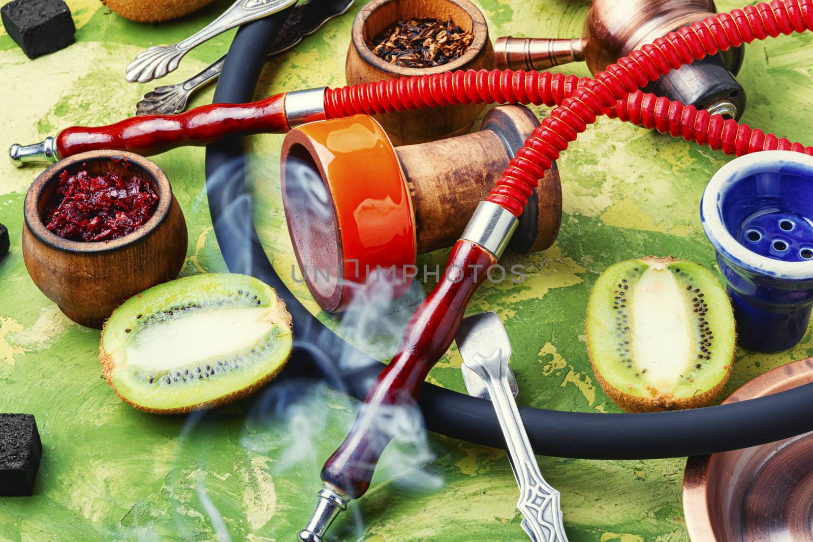 Arabic smoking hookah with taste of kiwi.Fruit shisha tobacco. Tobacco with taste of kiwi.Oriental hooka