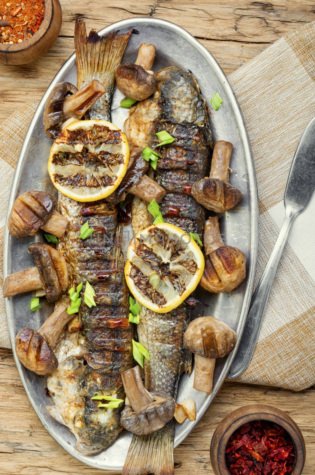 Grilled fish on a tray by LMykola