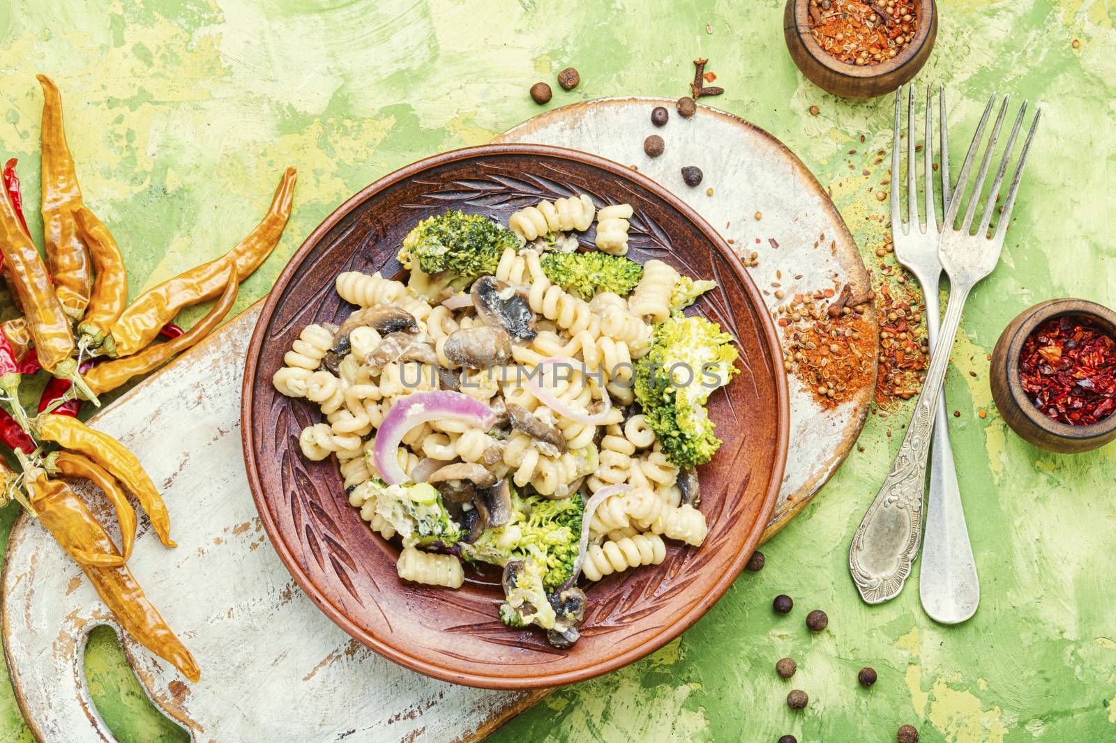 Italian pasta farfalle with broccoli and mushrooms.Italian food