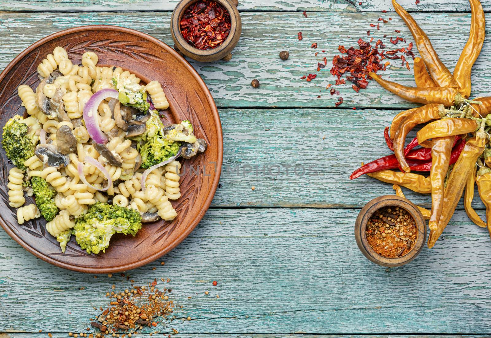 Italian pasta farfalle with broccoli and mushrooms.Italian food