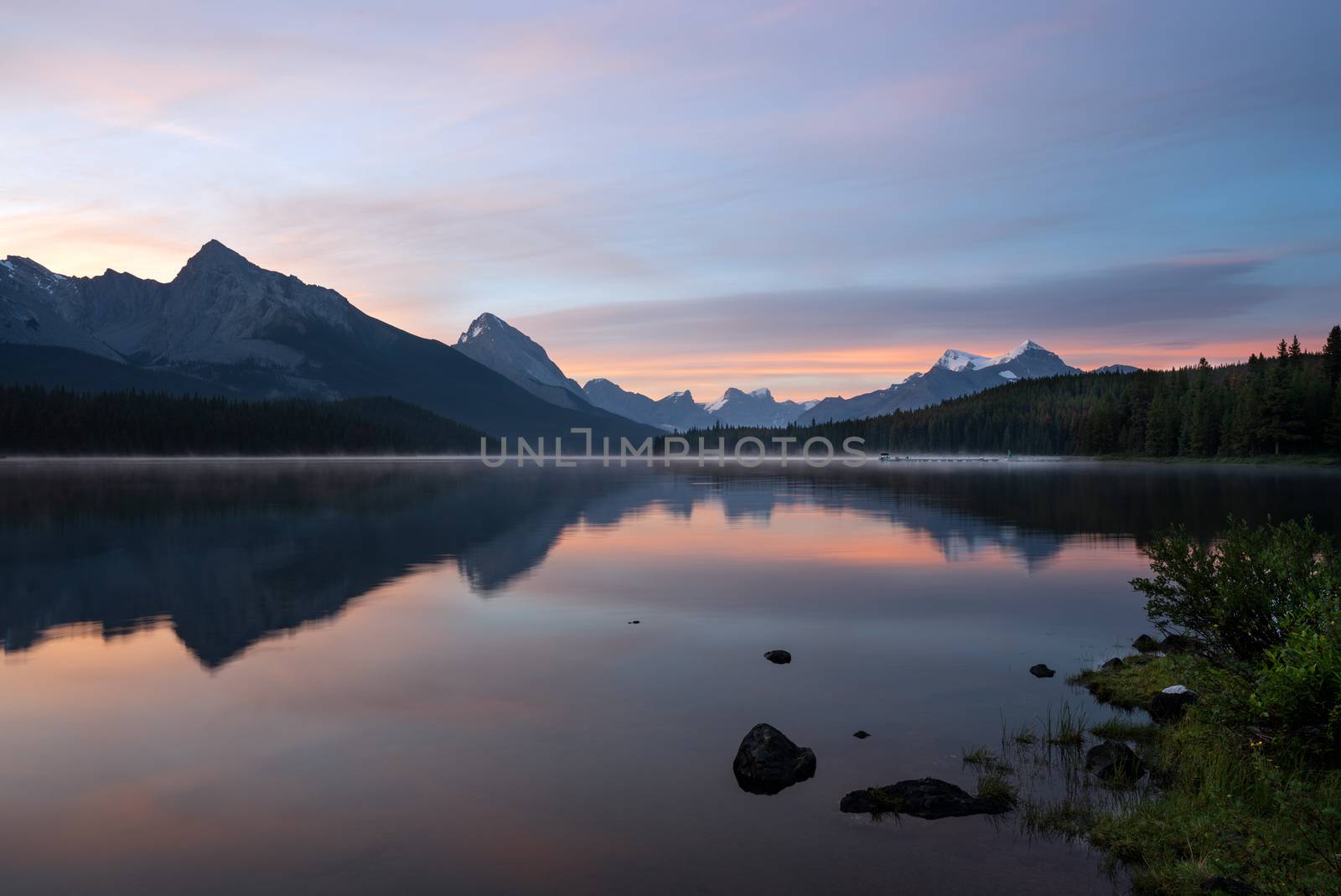 Long exposure panoramic image of the Maligne Lake close to Jasper with early morning mood, Alberta, Canada