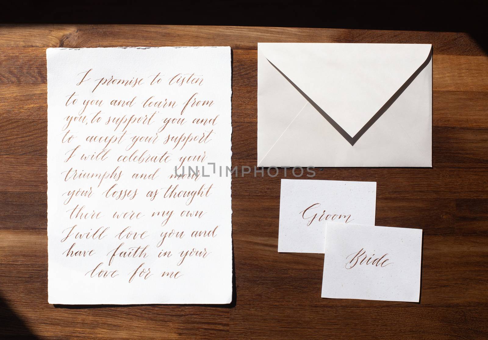 Wedding details flat lay on wooden background. Wedding invitation. Wedding bouquet. Copy space. Mock up. Envelope.