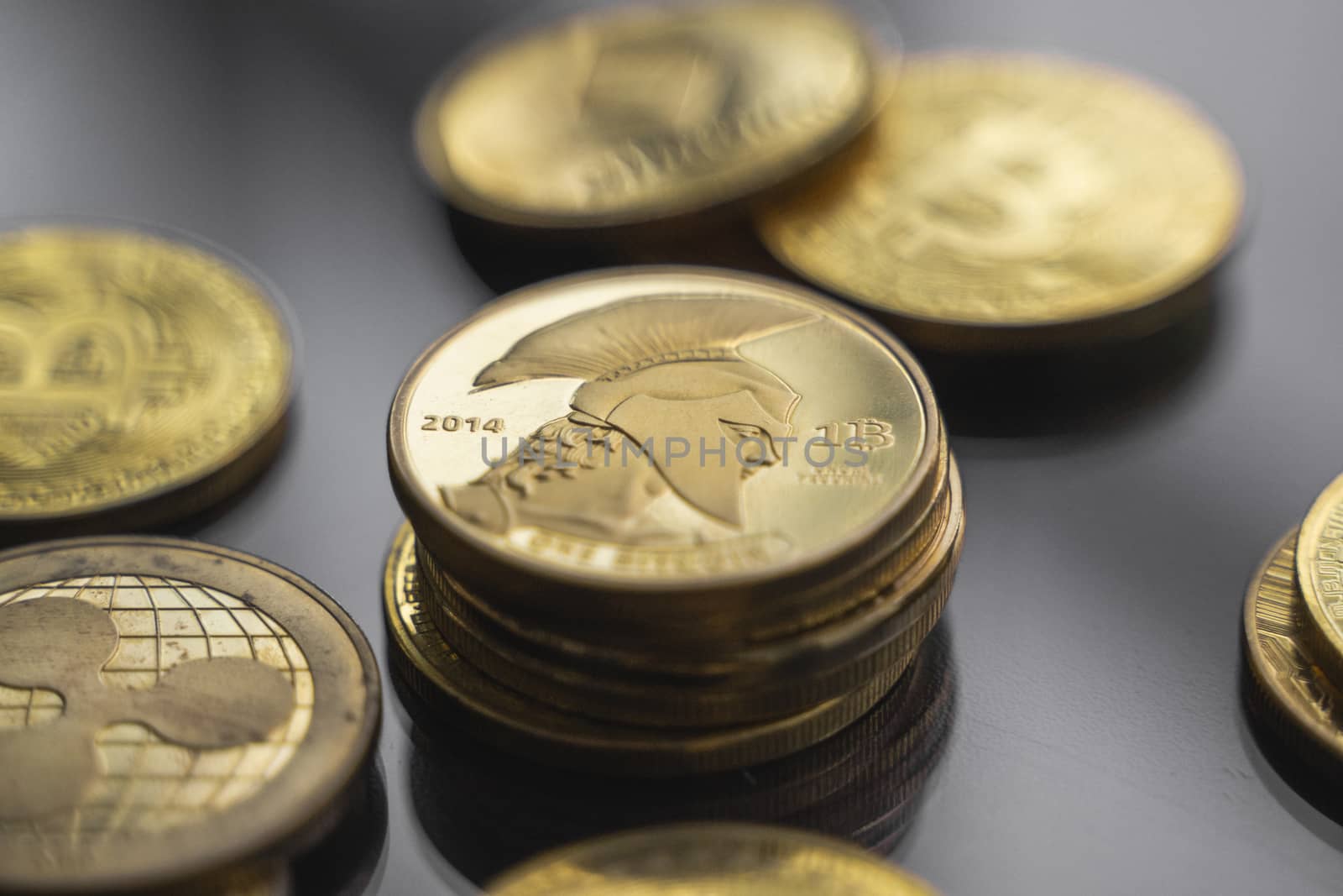 Stack of golden Titan bitcoin coin with a lot of bitcoins coins on a table. Virtual cryptocurrency concept. Mining of bitcoins online bussiness. Bitcoins trading