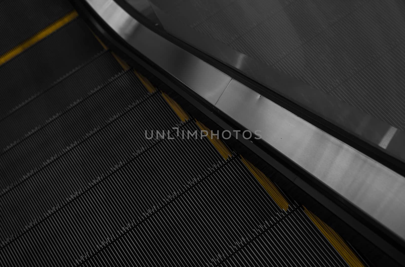 Modern escalator electronic system moving. Escalator is moving up.The ground is a straight line. Black with yellow band. by vovsht