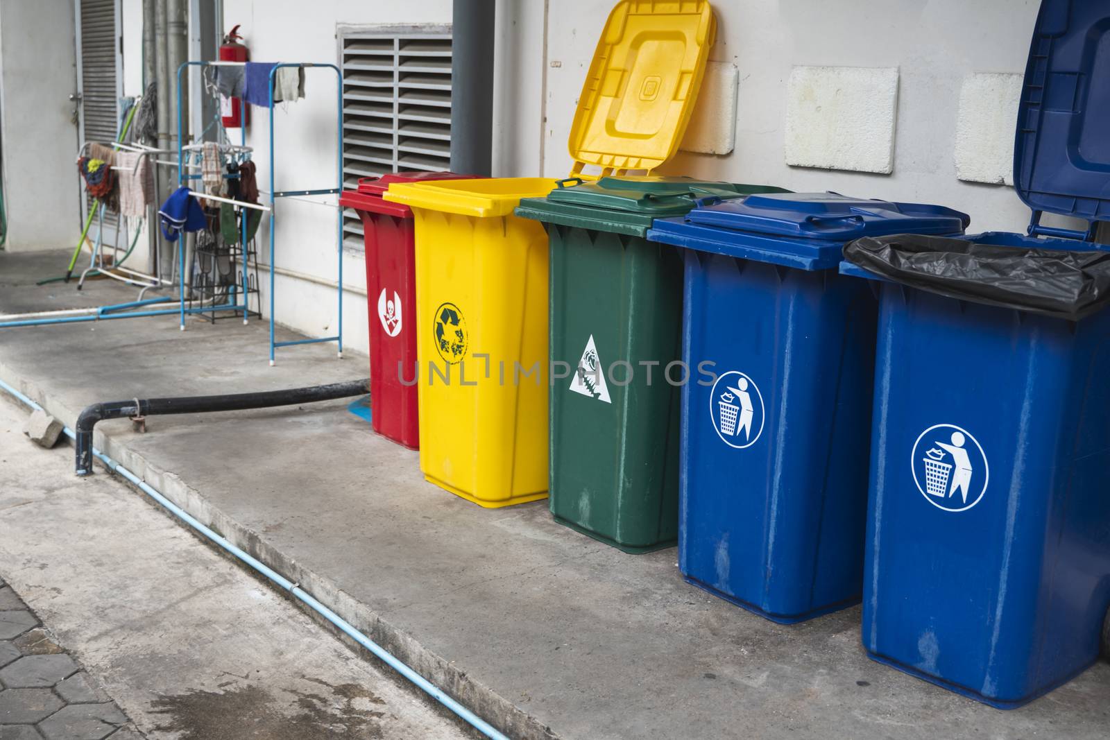 Garbage Trash Bins for collecting a recycle materials. Garbage trash bins for waste segregation. Separate waste collection food waste, plastic, paper and danger waste. Recycling. Environment