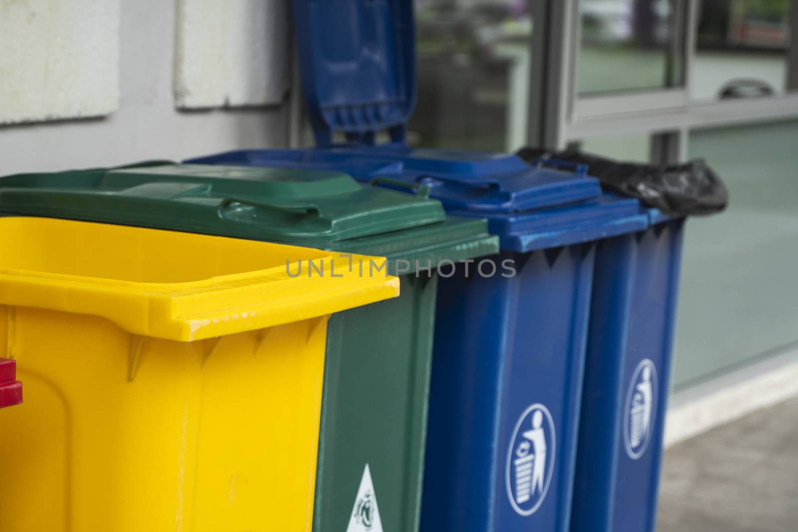 Garbage Trash Bins for collecting a recycle materials. Garbage trash bins for waste segregation. Separate waste collection food waste, plastic, paper and danger waste. Recycling. Environment