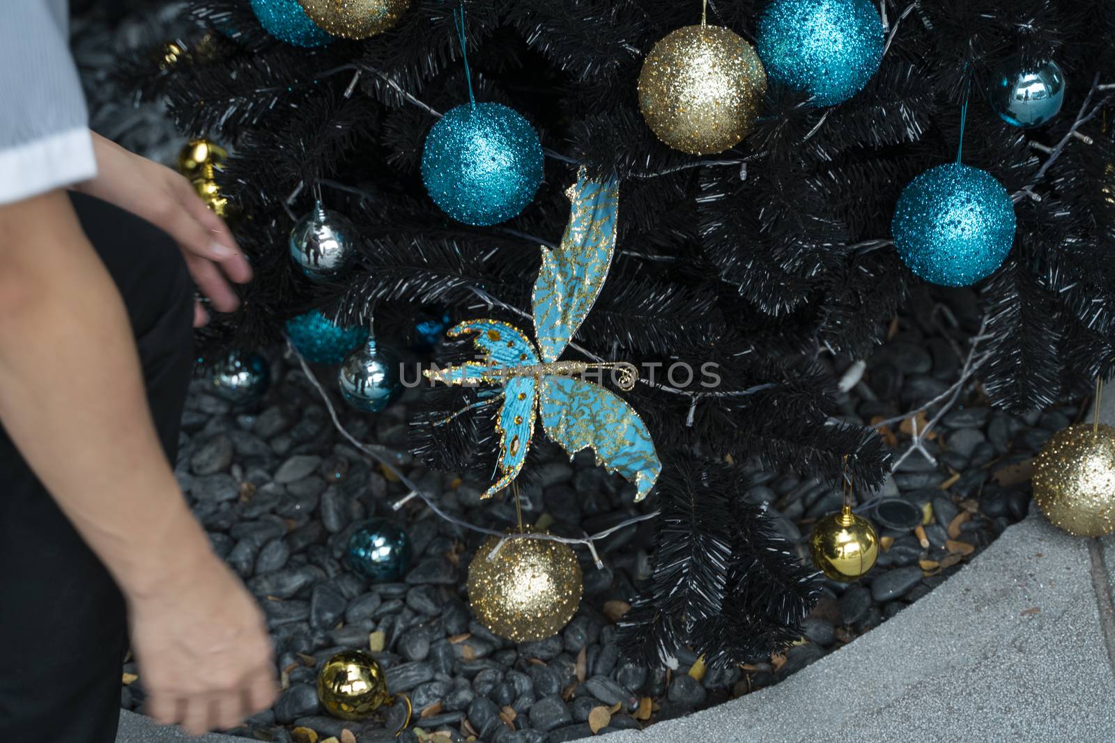 Decorated Christmas tree with a blue and gold toys and beautiful blue butterfly toy. Holidays. Preparation for New Year and Christmas. by vovsht
