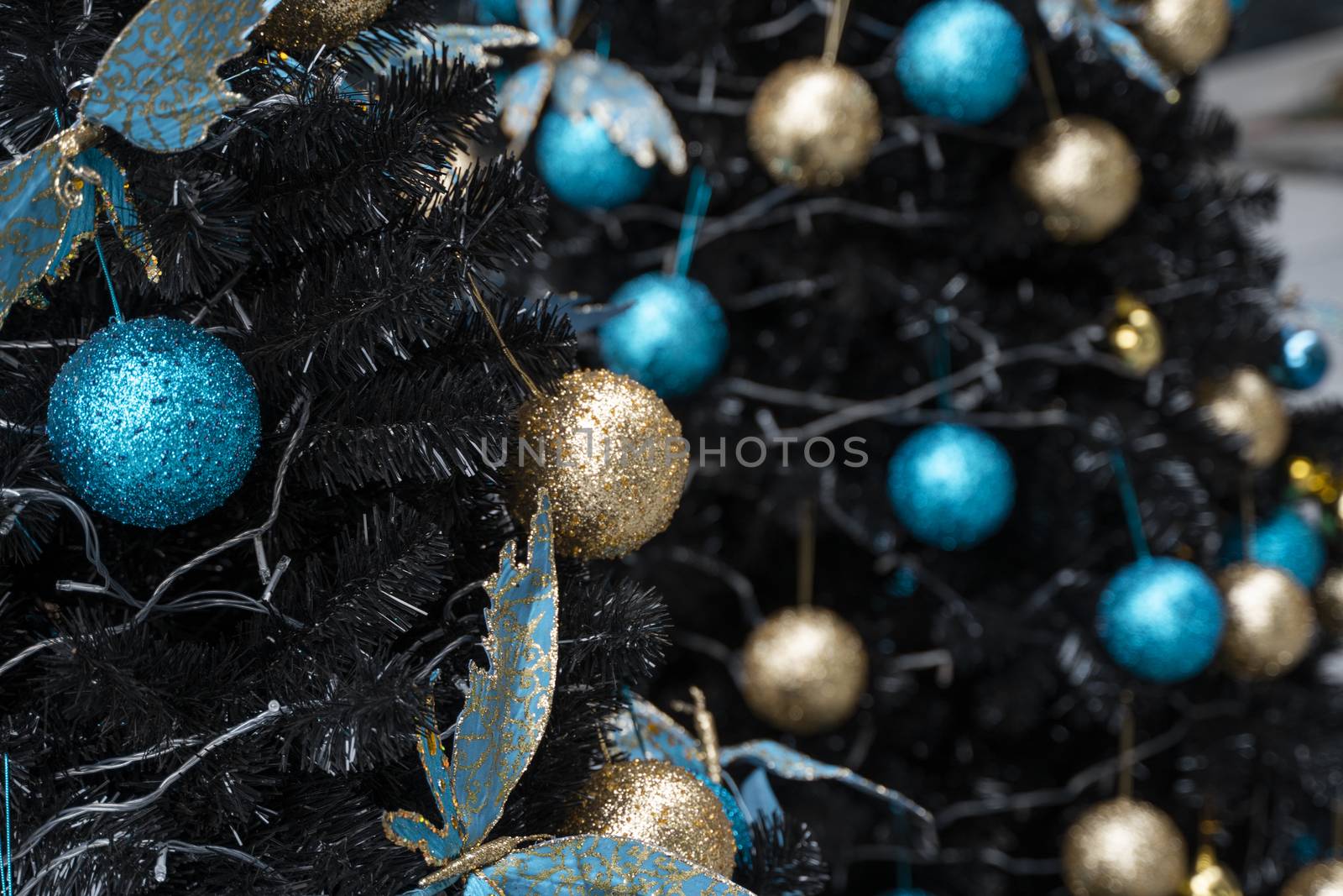 Decorated Christmas tree with a blue and gold toys and beautiful blue butterfly toy. Holidays. Preparation for New Year and Christmas. by vovsht