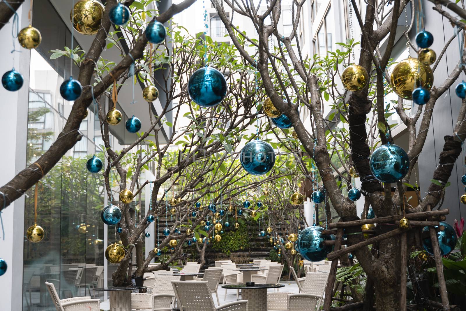 Decorated Christmas tree with a blue and gold toys and beautiful blue butterfly toy. Holidays. Preparation for New Year and Christmas