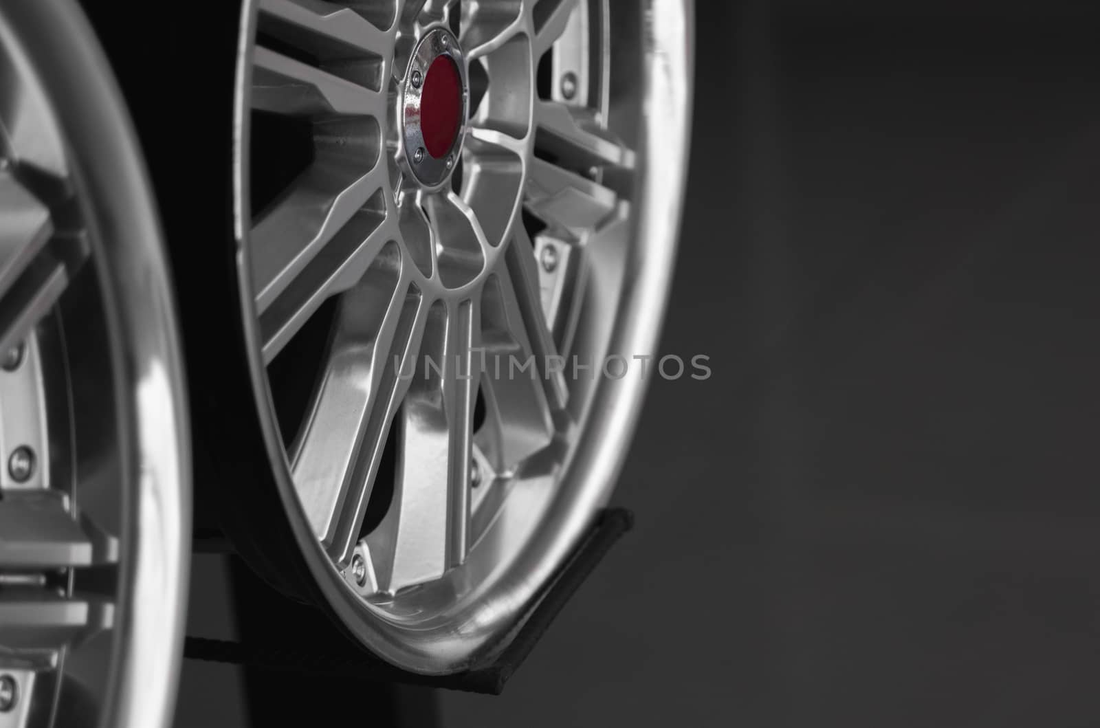 ar drives in the store with black background. Chrome car wheels for sale