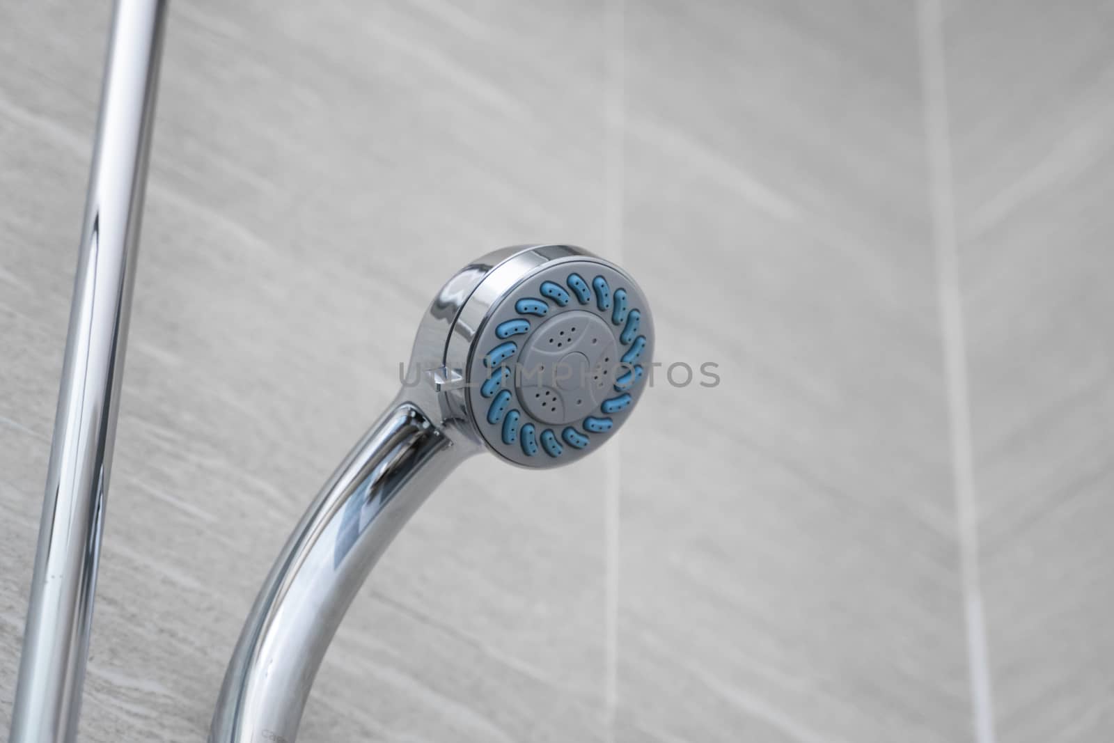 Modern shower head in modern bathroom. Shower head in bathroom with water spray or water flow. Feeling relax and enjoy in private bathroom. Fresh water flow from shower head for cleaning body dirty