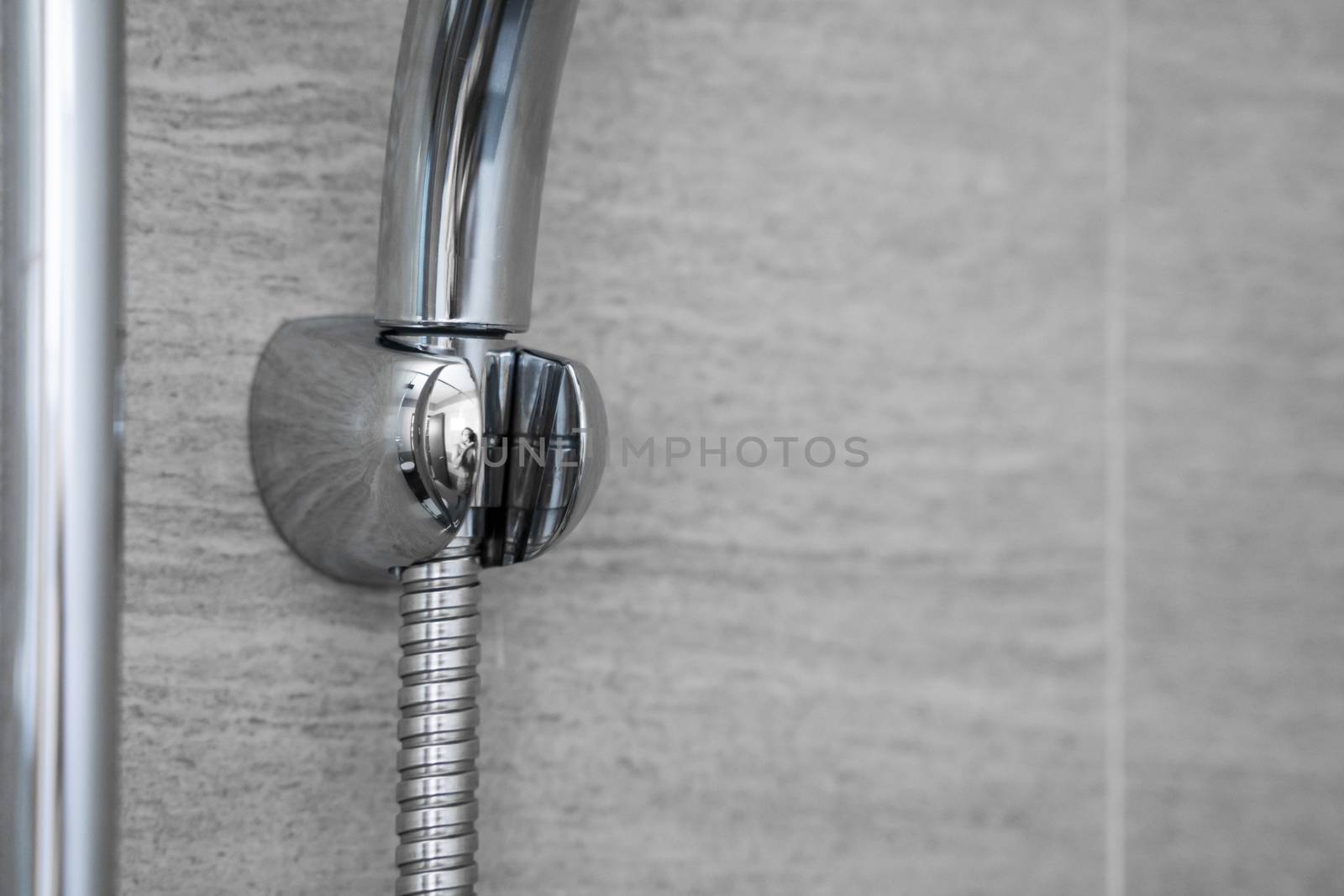 Chrome pipes and shower mounts in the modern bathroom. by vovsht